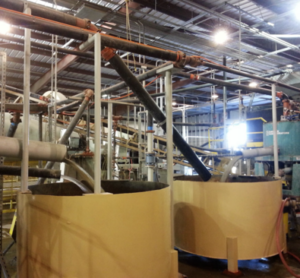 Concentrator equipment and pipework inside the mill.